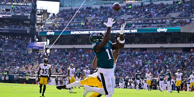 Eagles wide receiver A.J. Brown catches a touchdown pass against Pittsburgh Steelers cornerback Ahkello Witherspoon, Sunday, Oct. 30, 2022, in Philadelphia.