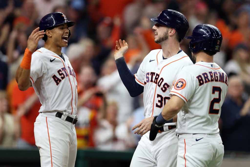 The Astros celebrate in the third inning. 