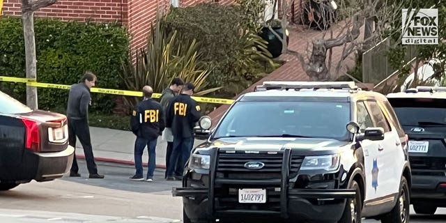 FBI investigators are seen outside the home of Nancy and Paul Pelosi where Paul was the victim of a violent home invasion, Friday October 28, 2022.