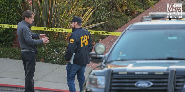 Paul Pelosi Jr. speaks to FBI investigators outside the home of his parents Nancy and Paul Pelosi, Friday October 28, 2022. His father, Paul was the victim of a violent home invasion earlier this morning.