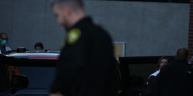 House Speaker Nancy Pelosi, D-Calif., (right) enters the Zuckerberg San Francisco General Hospital on Sunday after her husband was attacked inside their home. 