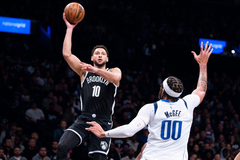 Ben Simmons shoots over JaVale McGee during the Nets' loss to the Mavericks.