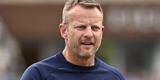 Bryan Harsin walks onto the field during the Rebels game at Vaught-Hemingway Stadium in Oxford, Mississippi, Oct. 15, 2022.