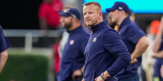 Bryan Harsin looks towards the scoreboard during the Bulldogs game at Sanford Stadium in Athens, Georgia, Oct. 8, 2022.