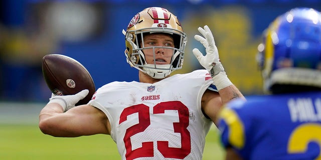 San Francisco 49ers running back Christian McCaffrey passes for a touchdown on a trick play during the first half against the Los Angeles Rams on Oct. 30, 2022, in Inglewood, California.