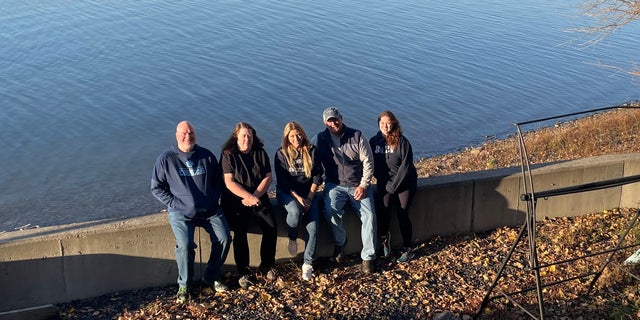 Team members (from left to right) — Ed Riddell, Kathy Eastman, Betty Miller, Kevin Cheney and Lindsey Agard — are pictured during a case before their work began at nightfall.