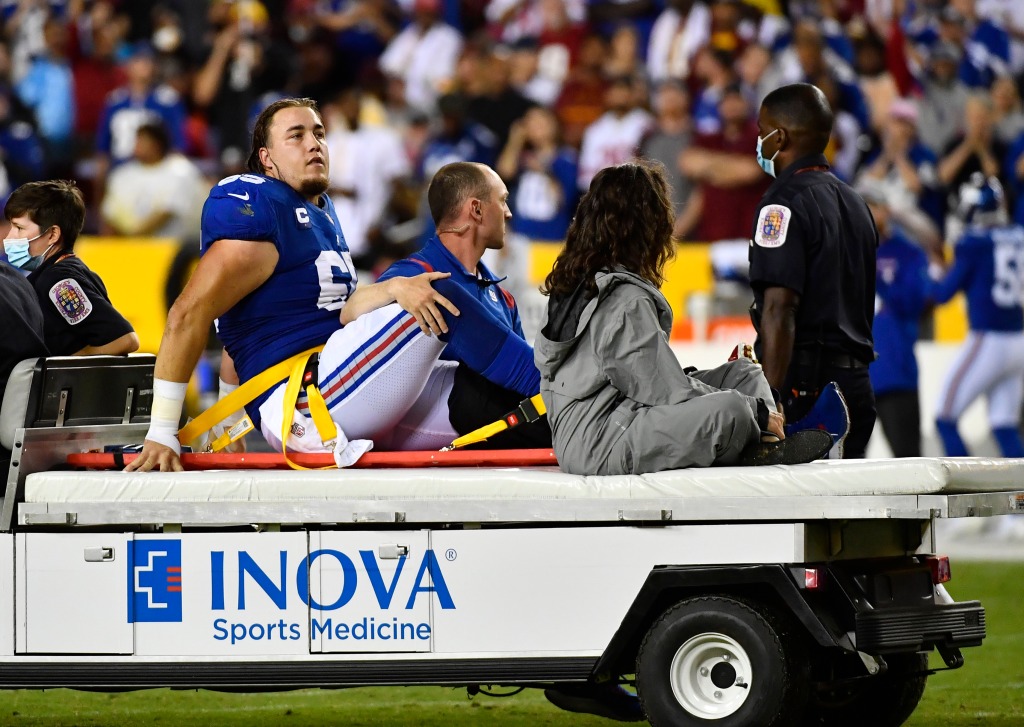 Nick Gates is carted off the field on September 16, 2021.