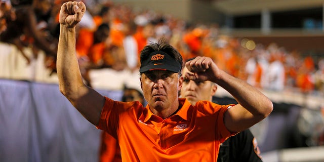 Head coach Mike Gundy of the Oklahoma State Cowboys celebrates after defeating the Texas Longhorns at Boone Pickens Stadium Oct. 22, 2022, in Stillwater, Okla. Oklahoma State won 41-34.  