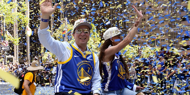 Owner Joe Lacob of the Golden State Warriors waves to fans during the Golden State Warriors' victory parade June 20, 2022, in San Francisco.