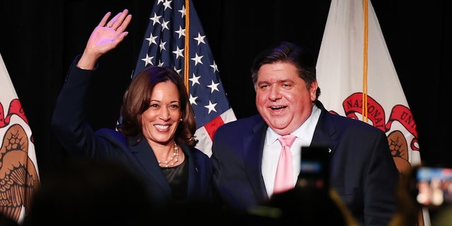 The law, which Democrat Gov. J.B. Pritzker of Illinois, right, signed last year, includes numerous provisions that proponents say will improve public safety in the state and make that criminal justice system more equitable.