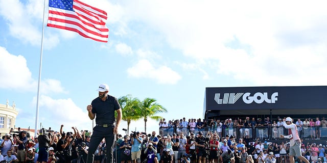 Team Captain Dustin Johnson of 4 Aces GC celebrates making his putt on the 18th green to win during the team championship stroke-play round of the LIV Golf Invitational - Miami at Trump National Doral Miami on October 30, 2022 in Doral, Florida. 