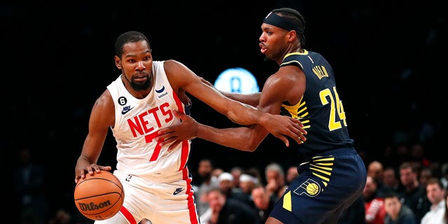 Brooklyn Nets forward Kevin Durant drives to the basket against Indiana Pacers guard Buddy Hield, Saturday, Oct. 29, 2022, in New York.