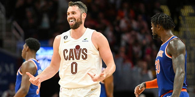 Cleveland Cavaliers forward Kevin Love, #0, celebrates after making a 3-point basket during the second half of an NBA basketball game against the New York Knicks, Sunday, Oct. 30, 2022, in Cleveland. 