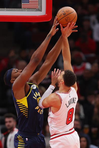 Pacers center Myles Turner blocks a shot by Zach LaVine #8 of the Chicago Bulls during the first half at United Center on Oct. 26, 2022 in Chicago, Illinois.