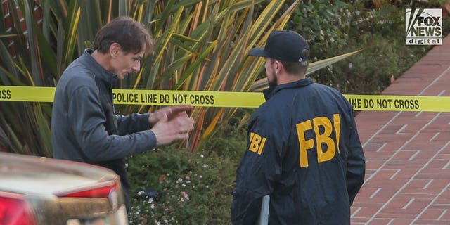 Paul Pelosi Jr. speaks to FBI investigators outside the home of his parents Nancy and Paul Pelosi, Friday October 28, 2022. His father, Paul was the victim of a violent home invasion earlier this morning.