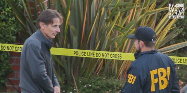 Paul Pelosi Jr. speaks to FBI investigators outside the home of his parents, Nancy and Paul Pelosi, Friday, October 28, 2022. His father was the victim of a violent home invasion earlier that morning.