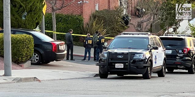 FBI investigators are seen outside the home of Nancy and Paul Pelosi where Paul was the victim of a violent home invasion, Friday, Oct, 28, 2022.