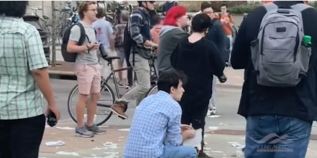 Leftist protesters shred Bible and one eats one of the pages outside Matt Walsh speaking event