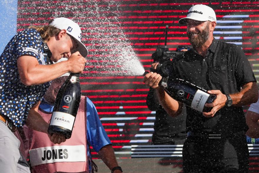 Cameron Smith (left) and Dustin Johnson have a champagne celebration following LIV Golf's team championship on Sunday, Oct. 30, 2022, at Trump National Doral Miami.