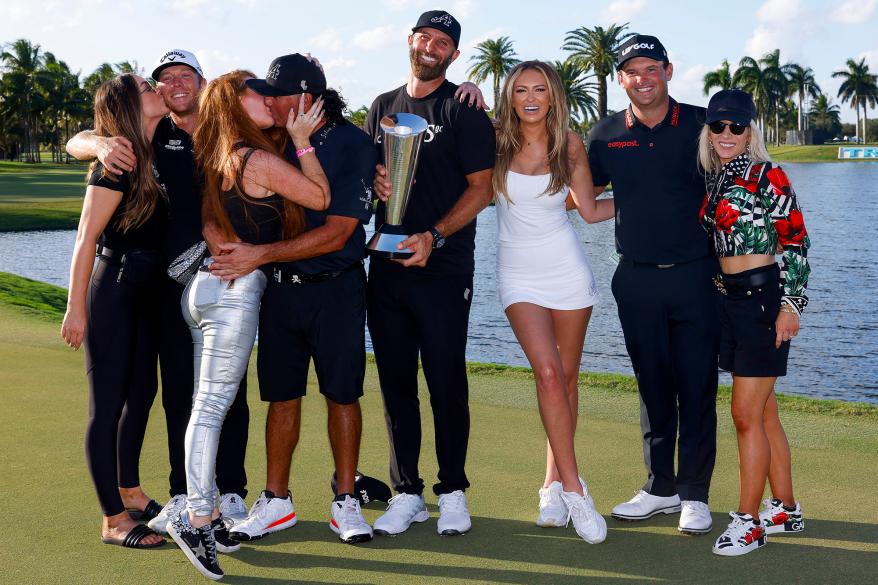 Dustin Johnson and Paulina Gretzky (fourth and third from right, respectively) celebrate with Johnson's 4 Aces GC teammates, Talor Gooch (second from left), Pat Perez (fourth from left), and Patrick Reed (second from right) on Sunday, Oct. 30, 2022, after winning the LIV Golf team championship.