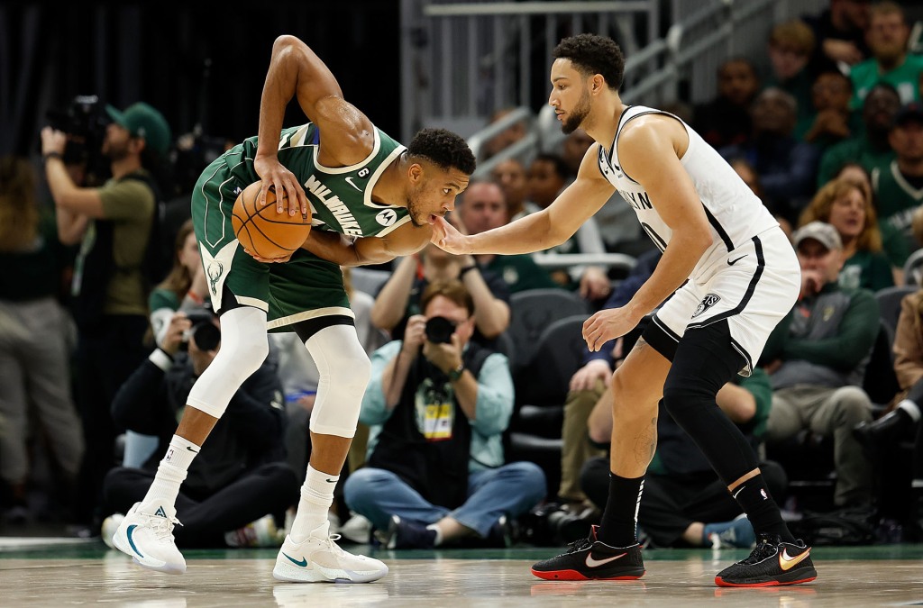 Giannis Antetokounmpo #34 of the Milwaukee Bucks looks to drive on Ben Simmons #10 of the Brooklyn Nets during the second half of the game at Fiserv Forum on October 26, 2022 in Milwaukee, Wisconsin.