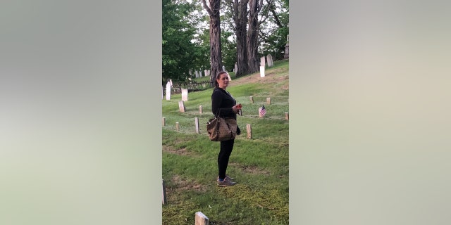 Investigator Lindsey Agard of Paranormal Investigators of New England checks out what the team said was a haunted cemetery.