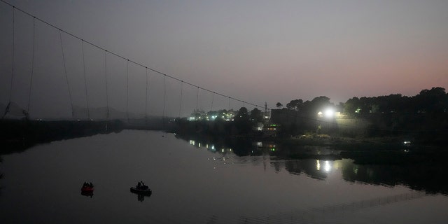 A century-old cable suspension bridge collapsed into the river Sunday evening, sending hundreds plunging in the water in one of the country's worst accidents in years.