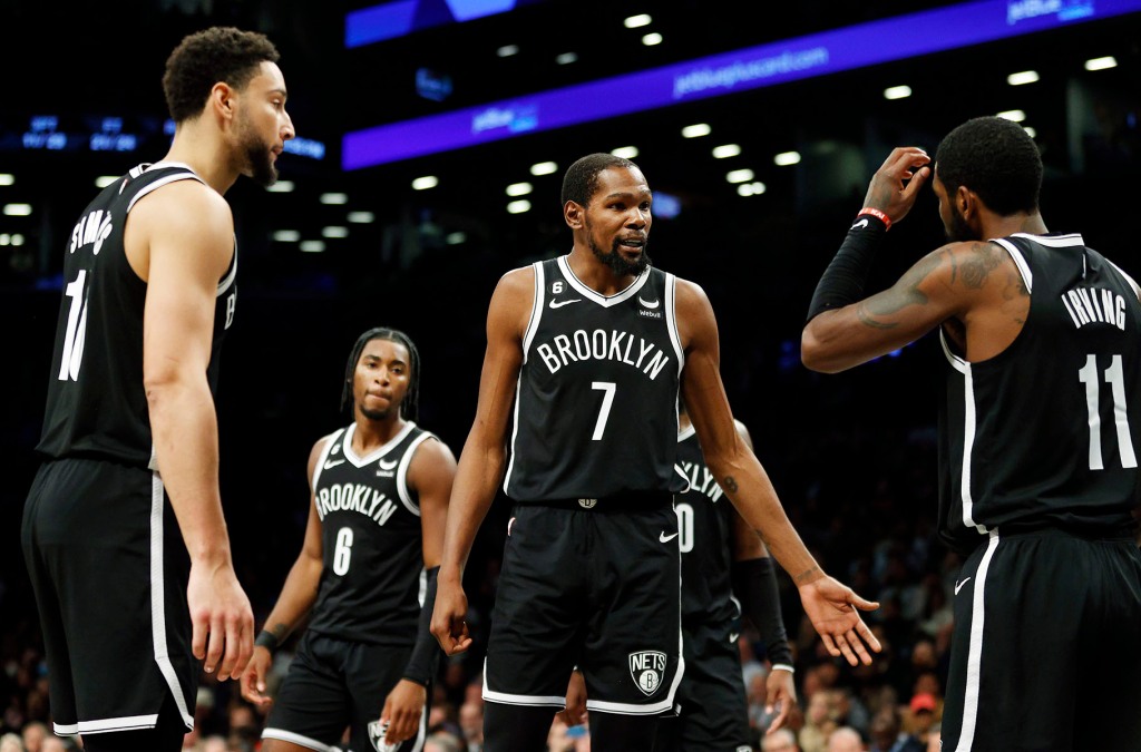 Kevin Durant #7 talks with Ben Simmons #10 and Kyrie Irving #11 of the Brooklyn Nets during the second half against the Dallas Mavericks at Barclays Center on October 27, 2022 in the Brooklyn borough of New York City. The Mavericks won 129-125. 