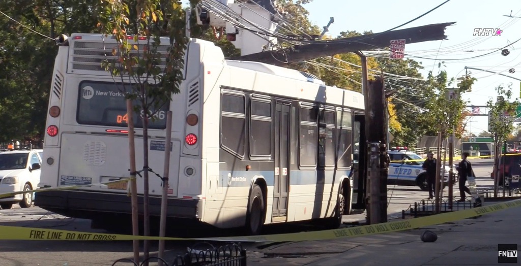 Queens bus hijacked, crashes into utility pole by a gunman.
