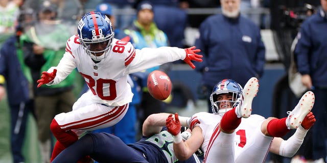 Richie James (80) of the New York Giants fumbles the ball against the Seattle Seahawks during the second quarter, Oct. 30, 2022, in Seattle, Washington.