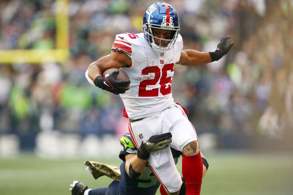 Giants running back Saquon Barkley (26) runs with the ball against the Seahawks on Oct. 30, 2022.