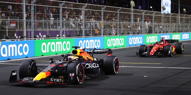 Max Verstappen of the Netherlands driving the (1) Oracle Red Bull Racing RB18 leads Charles Leclerc of Monaco driving (16) the Ferrari F1-75 during the F1 Grand Prix of Saudi Arabia at the Jeddah Corniche Circuit March 27, 2022, in Jeddah, Saudi Arabia. 