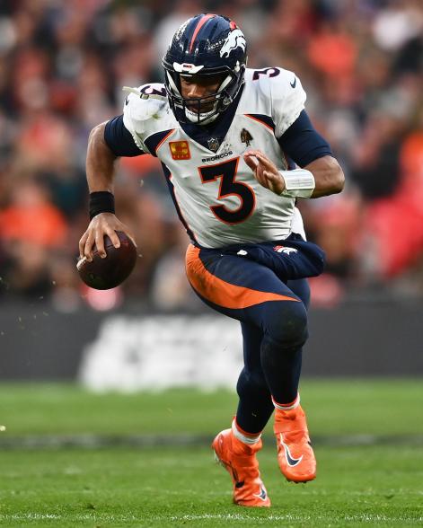 Broncos quarterback Russell Wilson runs with the ball during Sunday's game against the Jaguars.