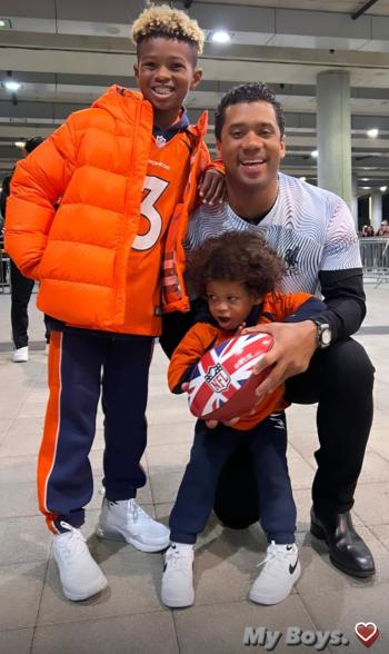 Broncos quarterback Russell Wilson celebrates Denver's win with his family.
