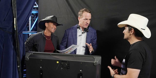 Tim McGraw, Peyton Manning and Brad Paisley during an ABC special.
