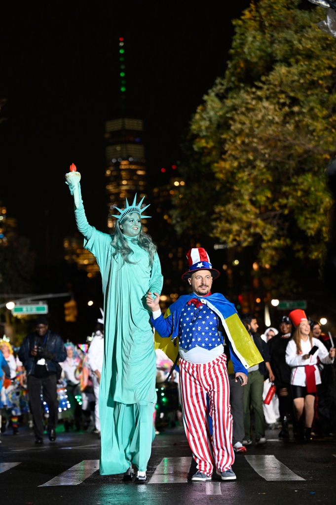 The Statue of Liberty and Uncle Sam pose during the 49th Annual Halloween Parade on Oct. 31, 2022 in Manhattan.