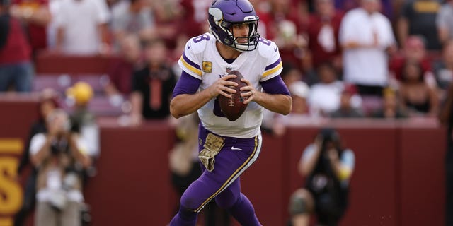 Kirk Cousins of the Minnesota Vikings scrambles during the third quarter against the Washington Commanders at FedExField, Nov. 6, 2022, in Landover, Maryland.